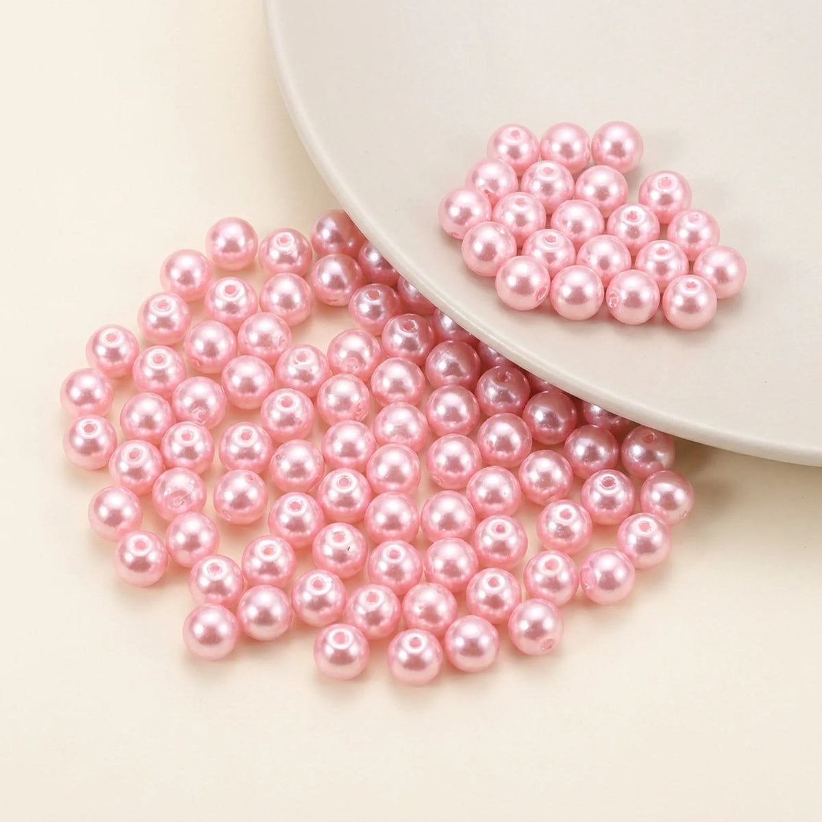 Close-up of Pink Czech Glass Pearl Beads with smooth pearl coated finish and round shape