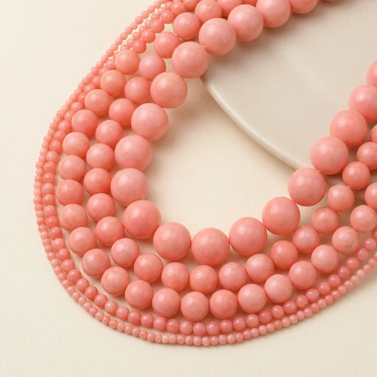 Pink sea bamboo coral round beads in multiple sizes with smooth polished finish
