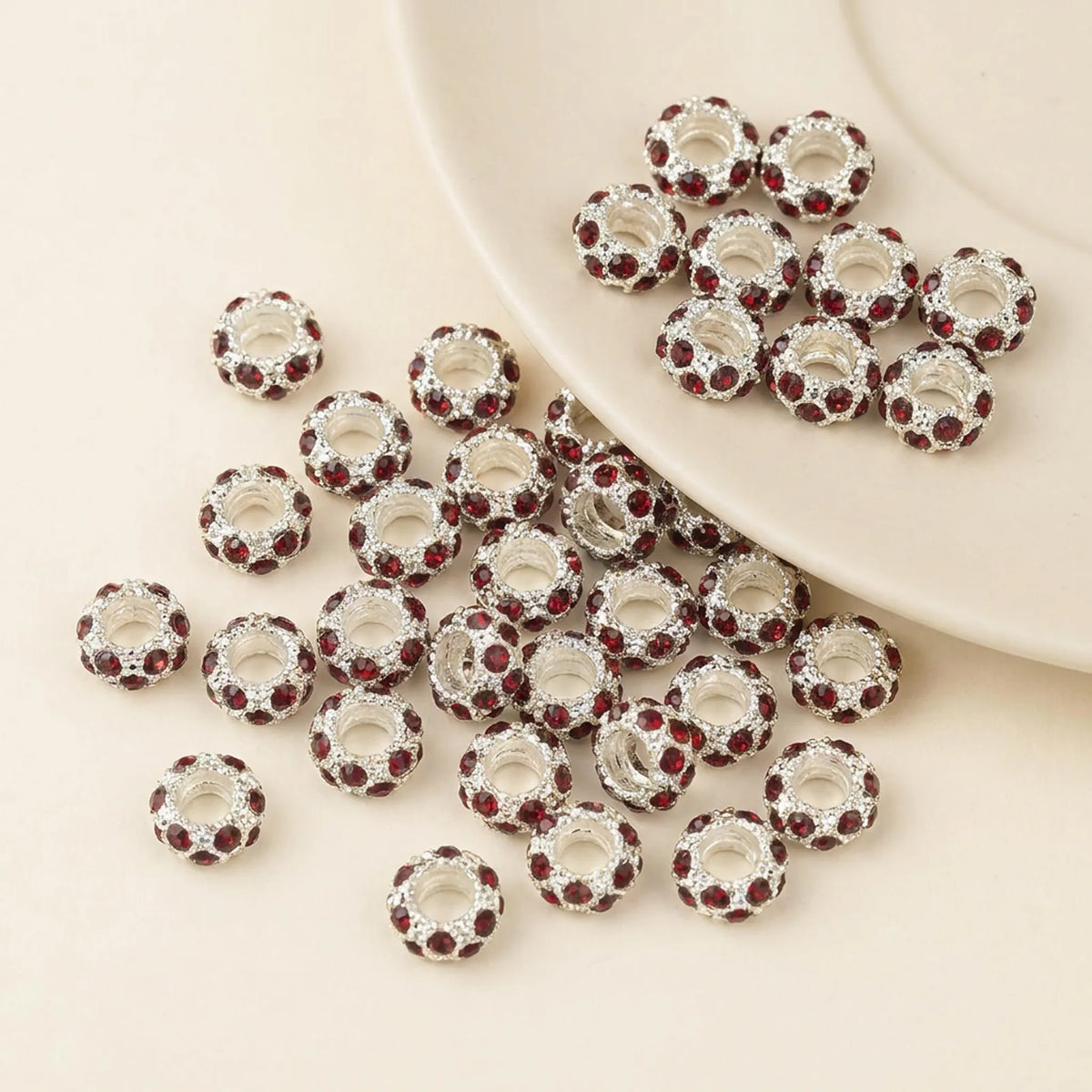 Red rhinestone spacer beads with large holes and silver tone finish