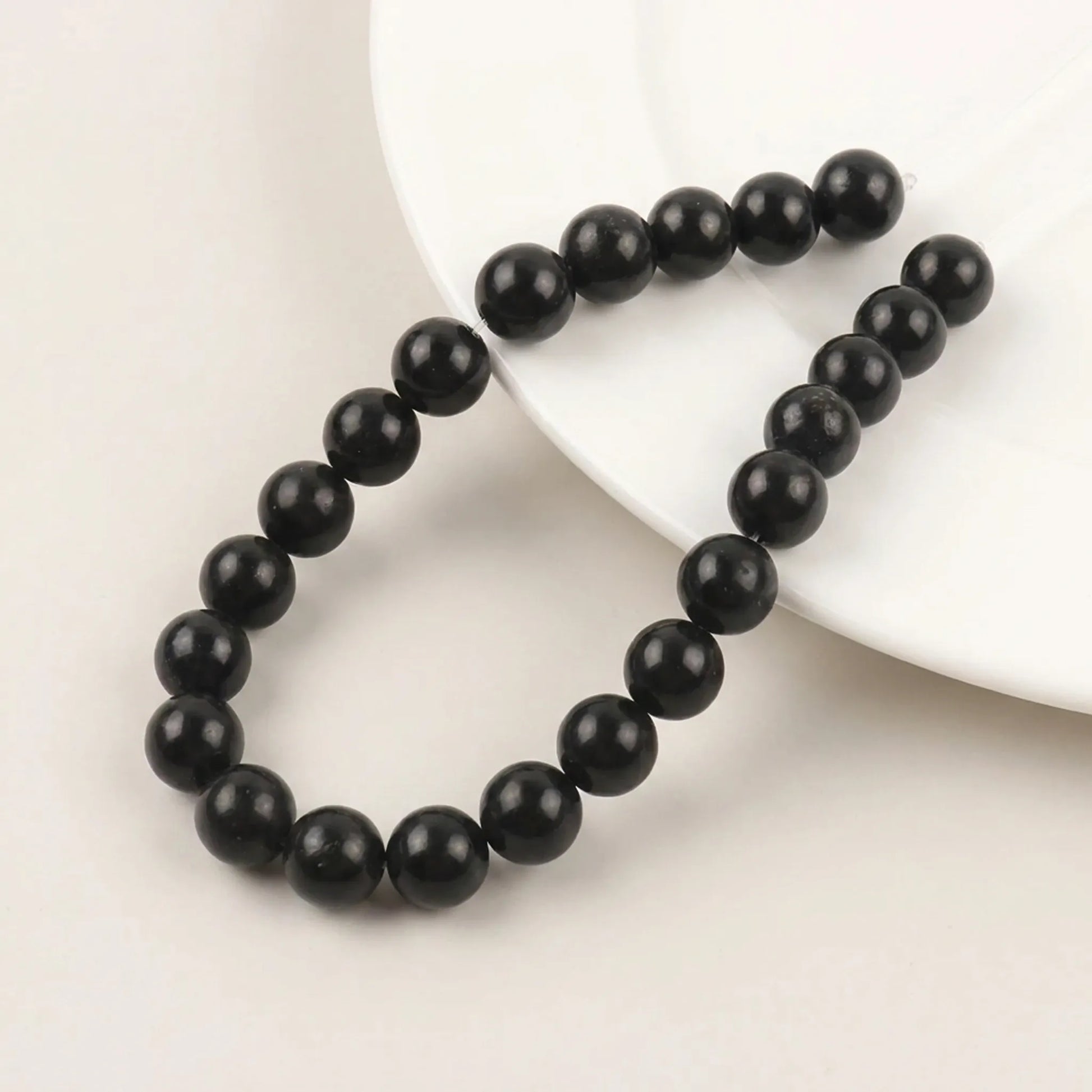 Round shungite beads with smooth black surface