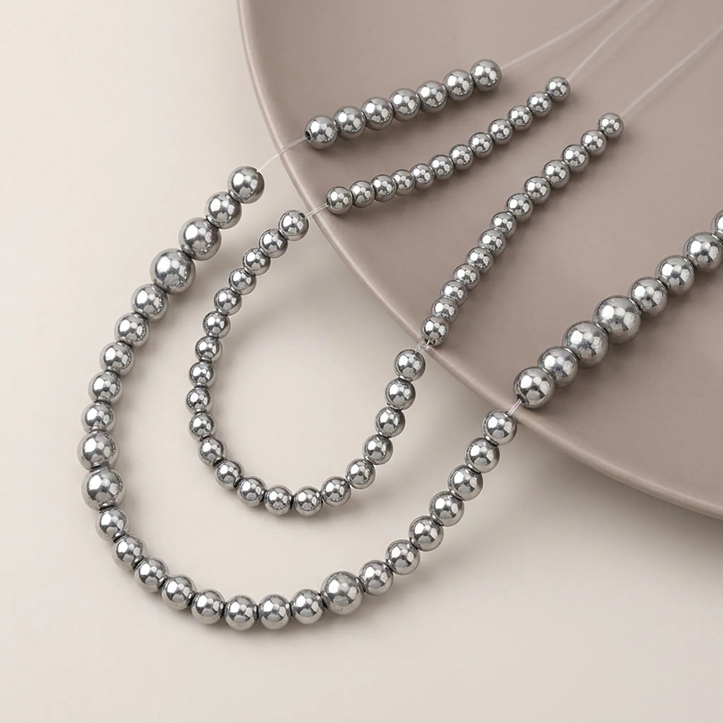 Round silver hematite beads with smooth metallic surface