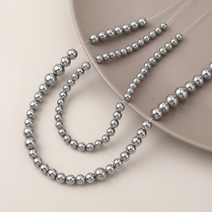 Round silver hematite beads with smooth metallic surface