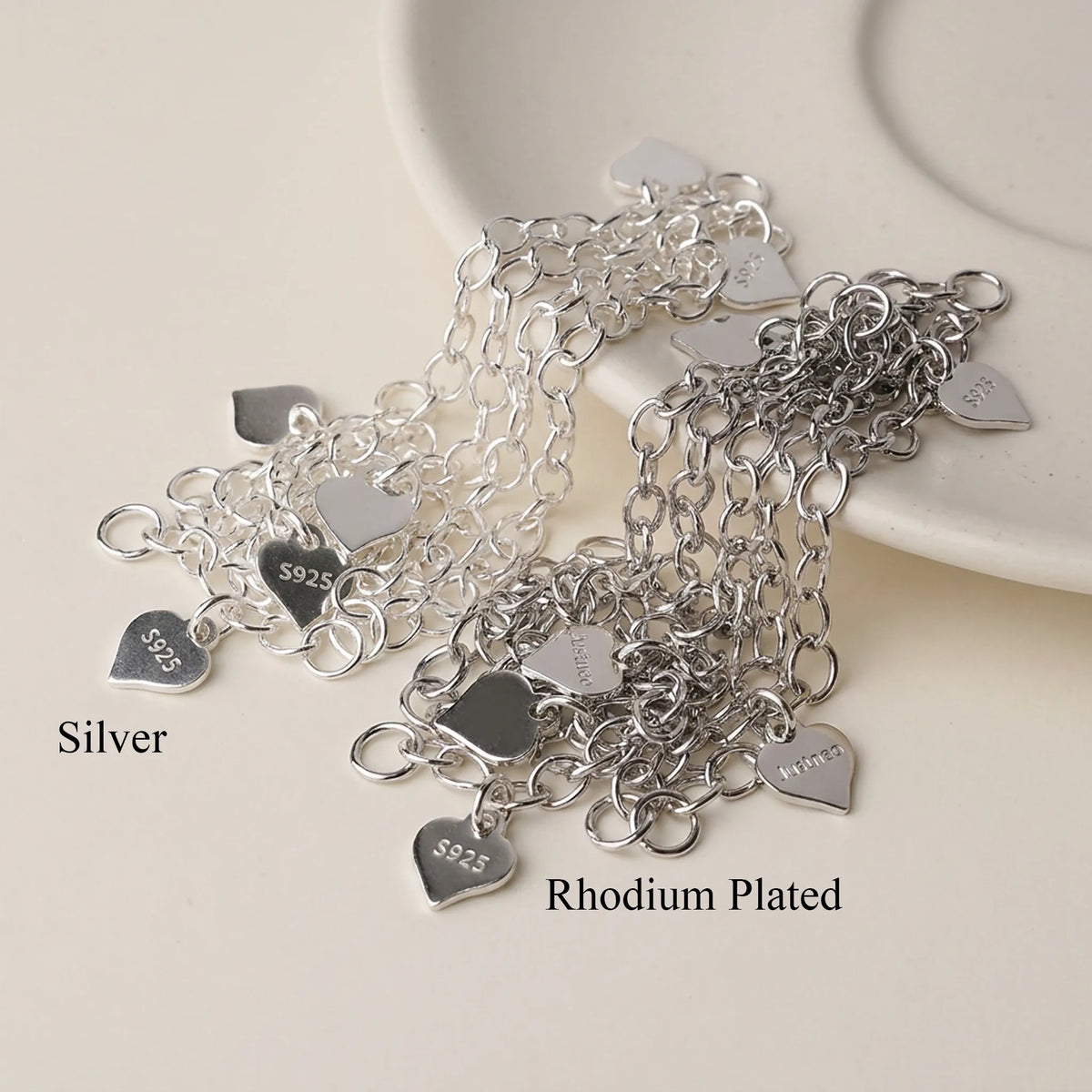 925 sterling silver chain extenders with heart tags shown in plain silver and rhodium plated finishes
