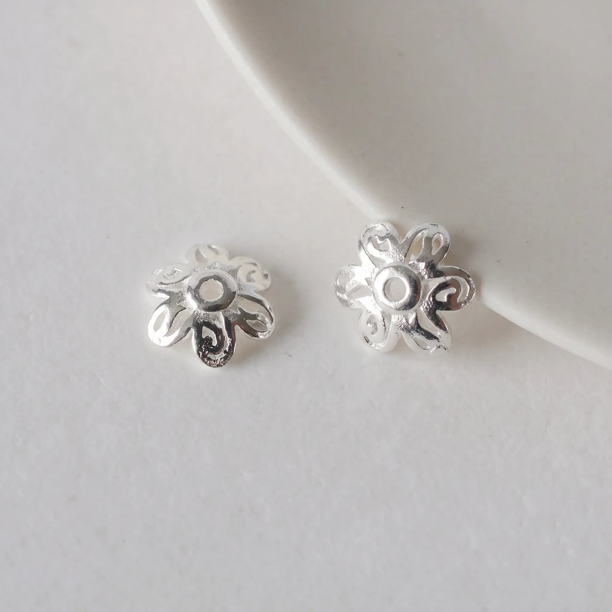 Pair of 6.4mm sterling silver flower bead caps with 0.8mm holes