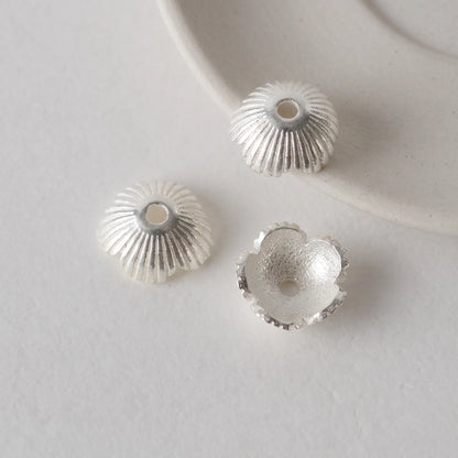 Sterling silver flower bead caps with ribbed exterior and scalloped edges