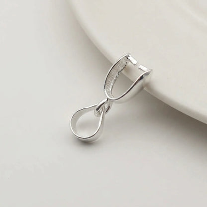 Open sterling silver pinch bail showing pendant attachment pins and bail loop