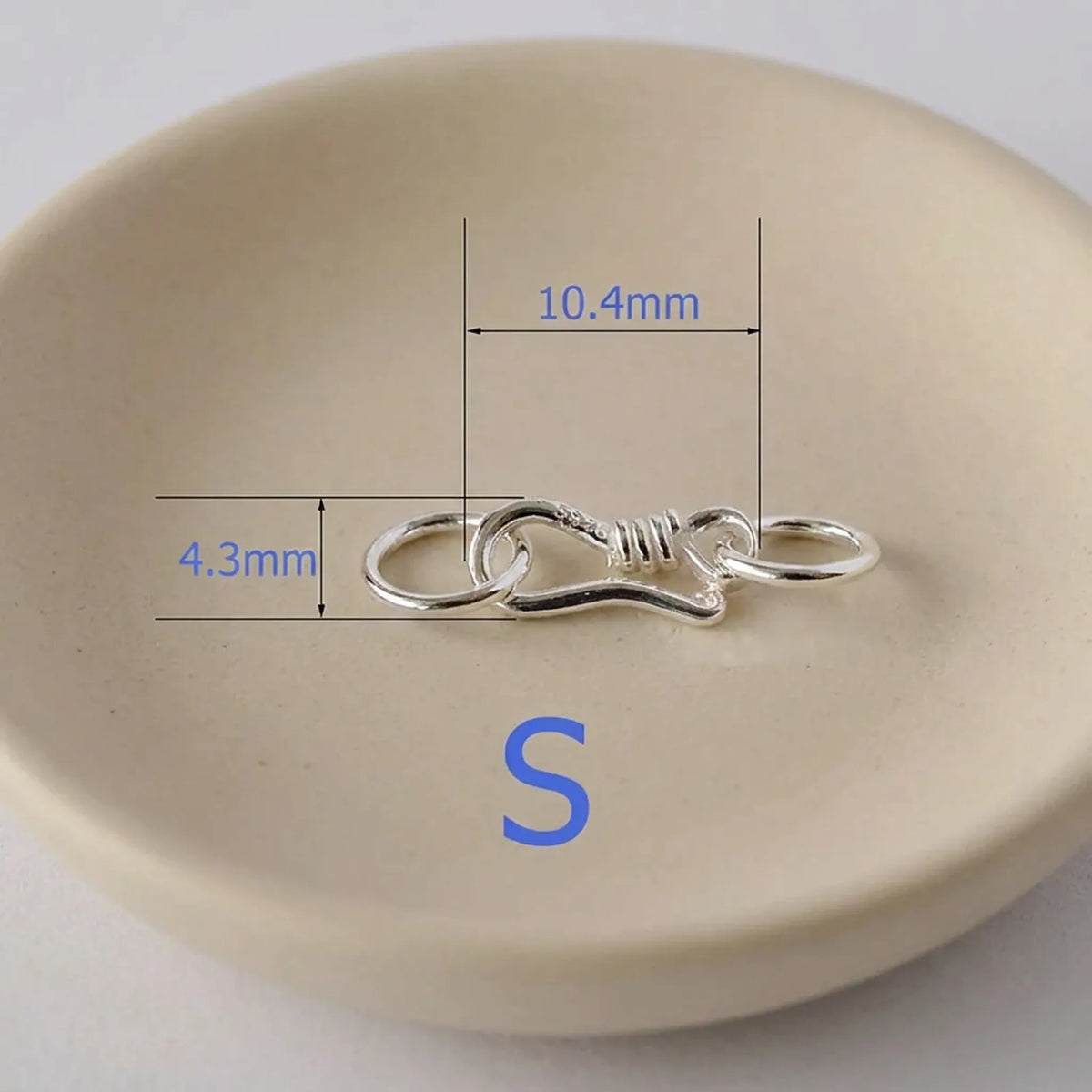 Small sterling silver S hook clasp measuring approximately 10.4 x 4.3 mm
