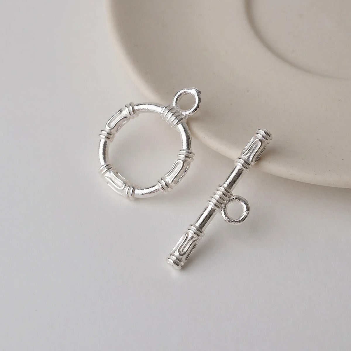 Sterling silver toggle clasp with textured ring and decorative T-bar for jewelry making