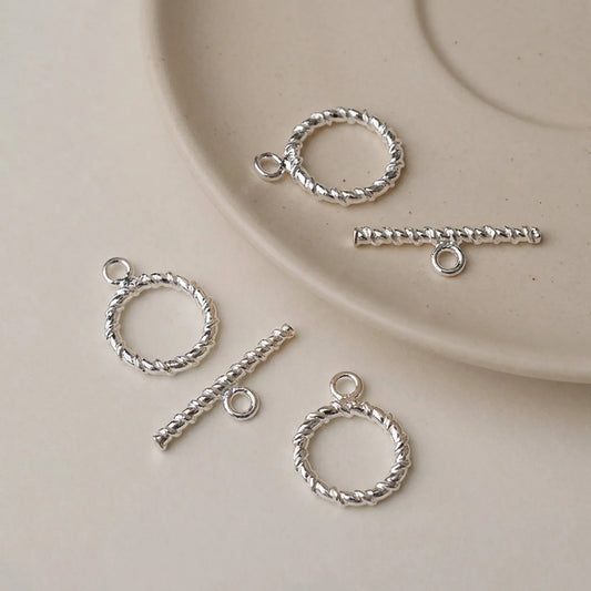 Sterling silver twisted toggle clasps with round rings and textured bars
