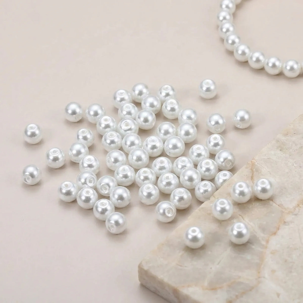 White glass pearl round beads used in a handmade necklace