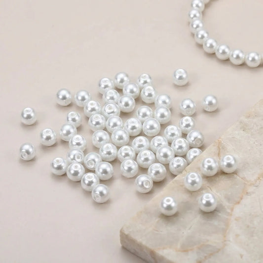 White glass pearl round beads used in a handmade necklace