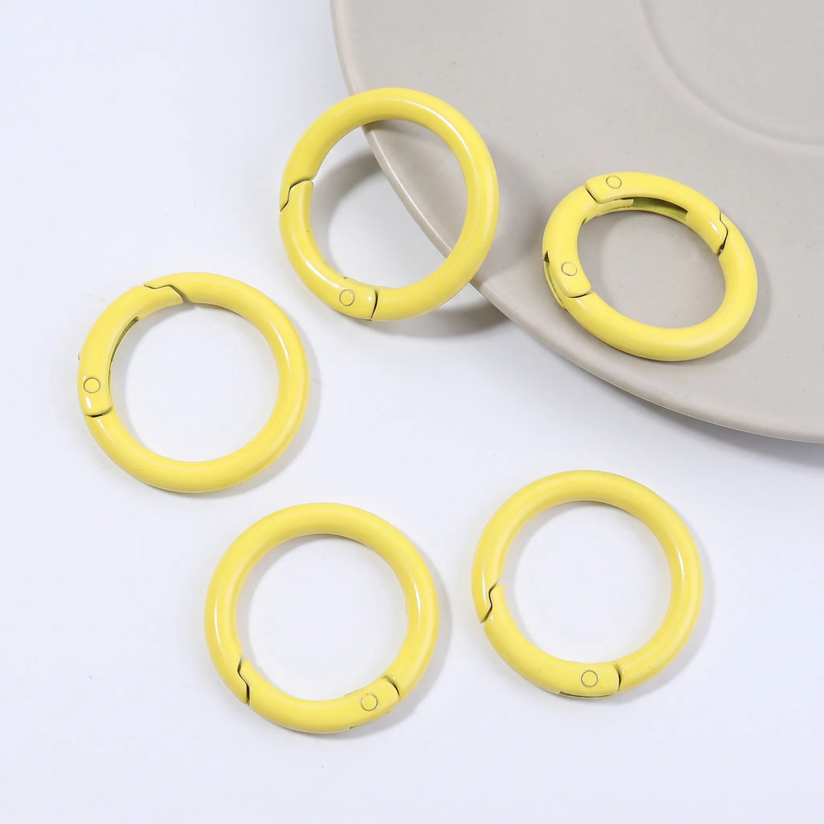 Yellow metal round carabiner clasps with openable spring closure