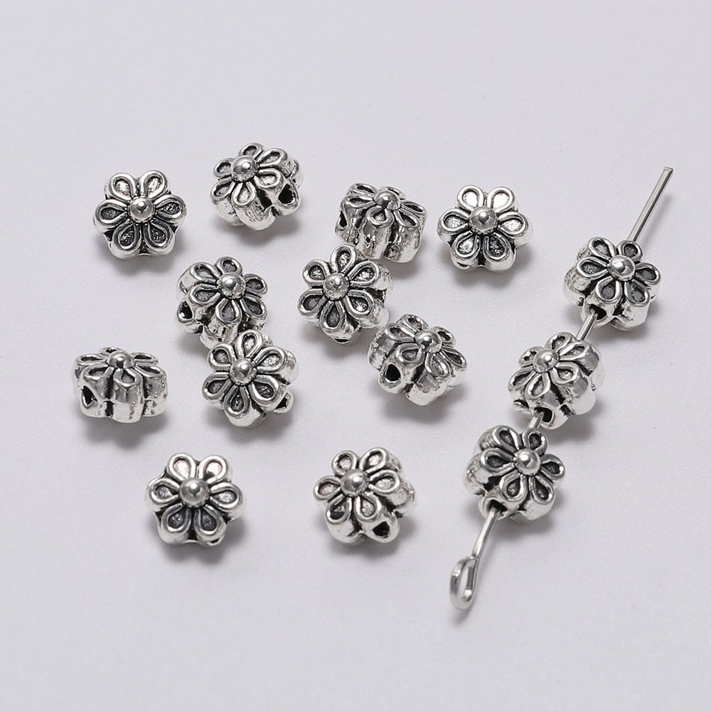 6 mm tibetische antike Spacer-Blumenperle, 50 Stück