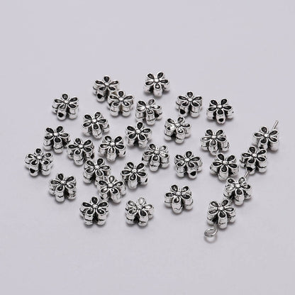 6 mm tibetische antike Spacer-Blumenperle, 50 Stück