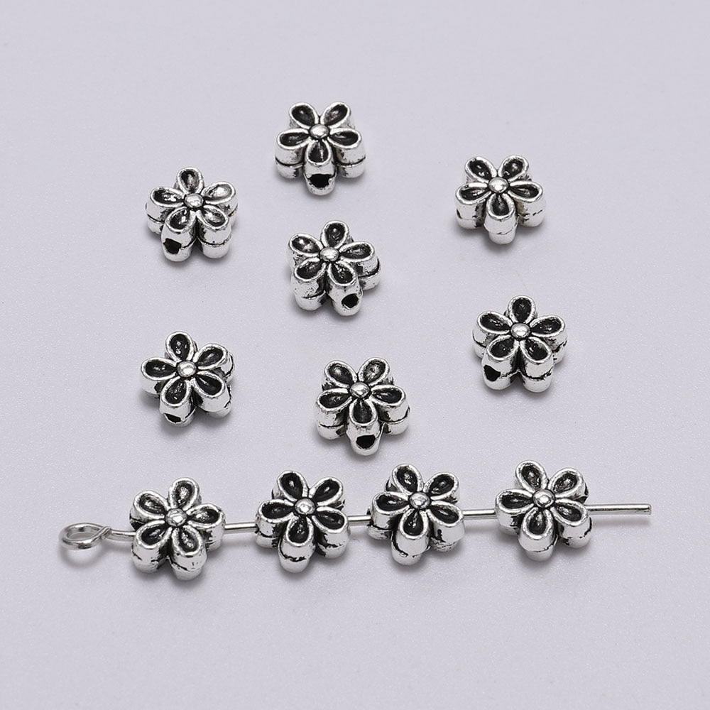 6 mm tibetische antike Spacer-Blumenperle, 50 Stück