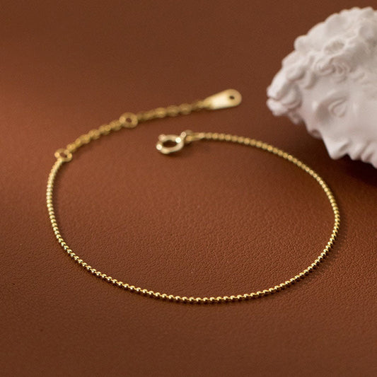 Bracelet de petites perles couleur or